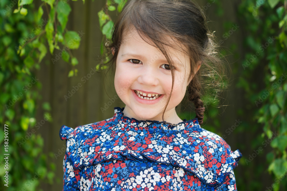 Little girl playing in the garden