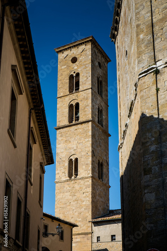 VOLTERRA, TUSCANY - MAY 21, 2017 - Baptistery of San Giovanni Battista and tower of Cathedral