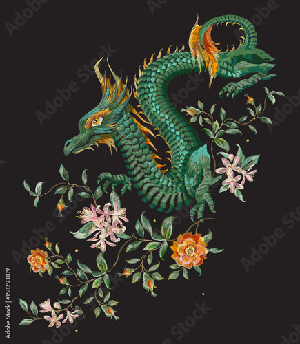 Embroidery oriental floral pattern with green dragon and gold roses. Vector ethnic folk embroidered template with flowers, orange blossom and animal on black background for fashion design. © natagalitskaia