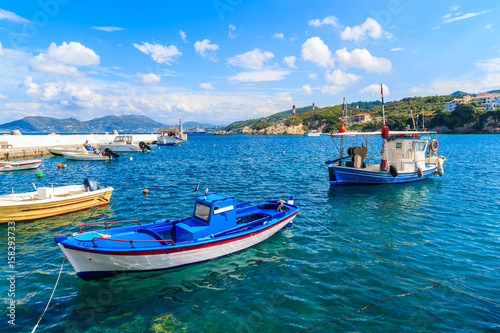 Typical fishing boats in Kokkari port on beautiful summer day, Samos island, Greece