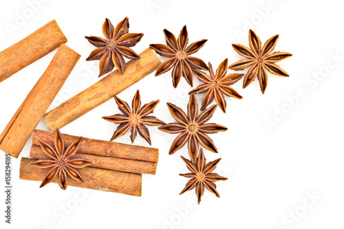 Star anise and cinnamon sticks herb isolates on white back ground