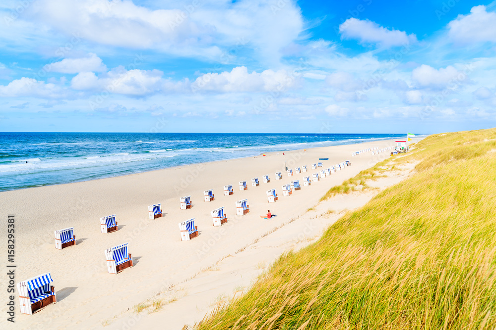 Chairs on sandy beach in List village, Sylt island, North Sea, Germany Chairs on sandy beach in List village, Sylt island, North Sea, Germany