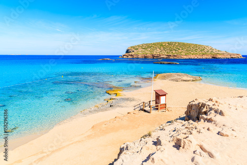 Lifeguard tower on beautiful Cala Comte beach famous for its azure crystal clear shallow sea water  Ibiza island  Spain