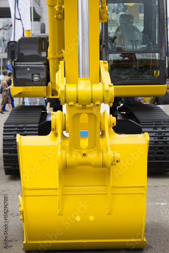 Big yellow bucket scoop at digger machine
