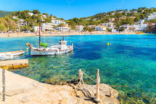 Obraz na płótnie Fishing boat in Cala Vadella bay, Ibiza island, Spain w salonie