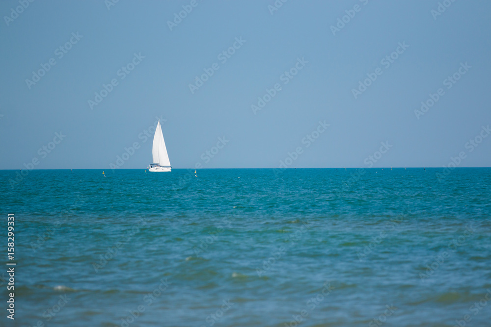 Sailing Ship yachts with white sails in the open Sea