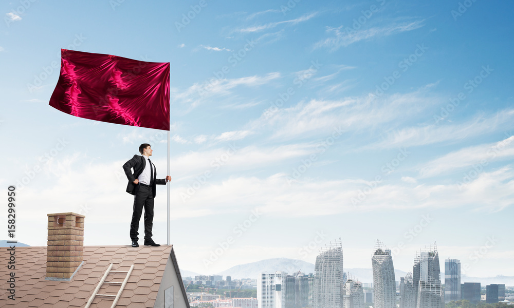 Young businessman with flag presenting concept of leadership. Mixed media Young businessman with flag presenting concept of leadership. Mixed media