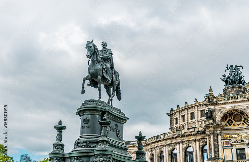 Tourist attractions of Dresden. The central historical square. Monument to the Emperor and the facade of the opera house