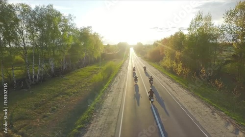 bikers ride into the sunset photo