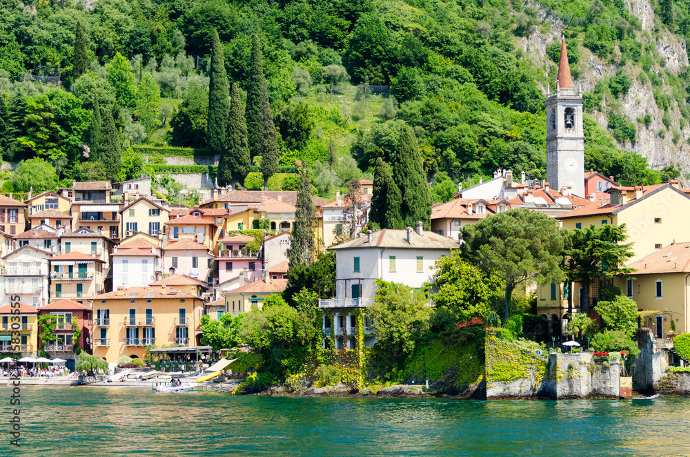 Colorful town Varenna seen from Lake Como on a sunny day, Italy