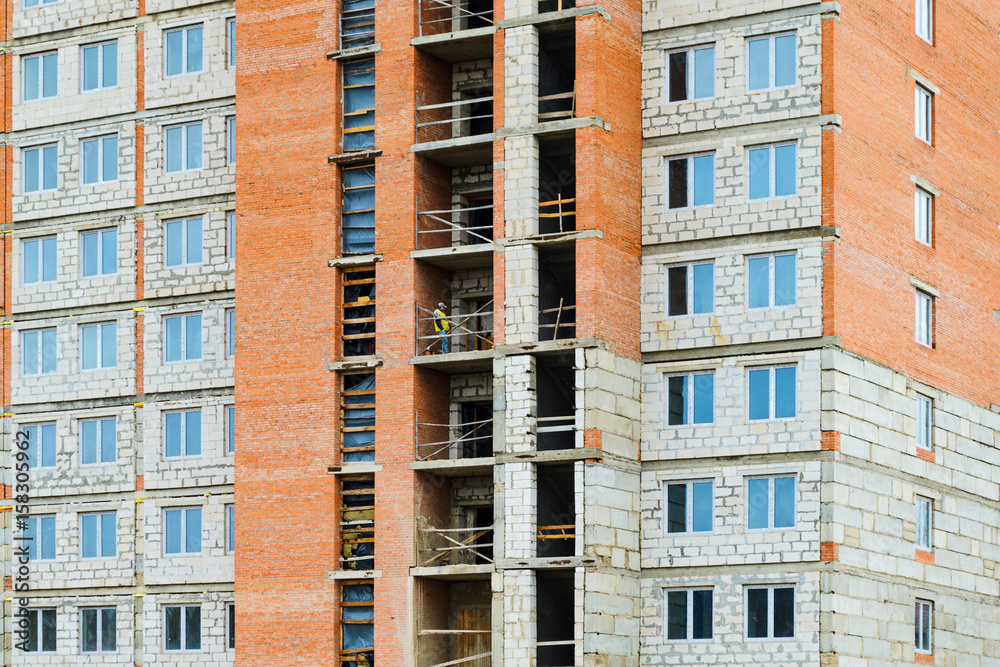 Facade of a multi-storey residential building under construction