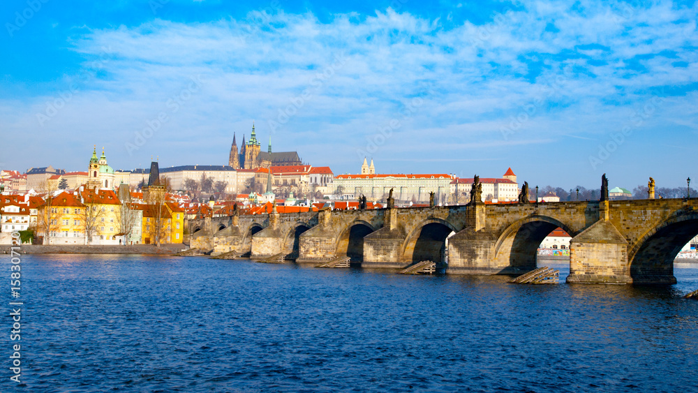 Prague Hradcany Panorama on sunny day. Charles Bridge over Vltava River with Prague Castle, Czech Republic.