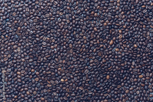 Coffee beans on wooden surface.Background with coffee photo