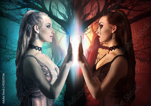 Konstfotografi Two sides of a human being. Evil and kind sides of a woman photo.
