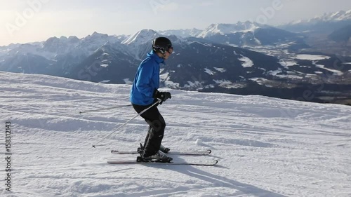 skier in slow motion in austrian Alps, skiing in beautiful mountain landscape