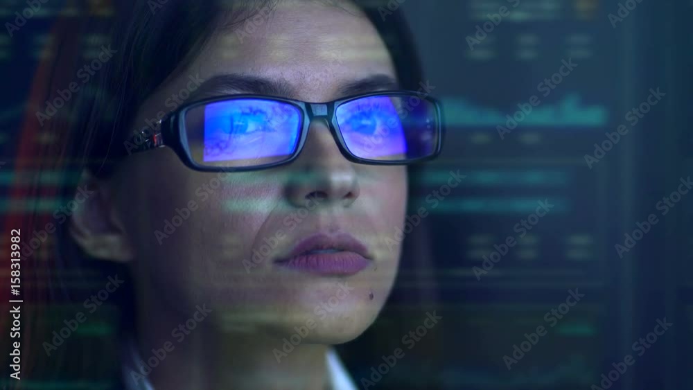 The businesswoman look to the virtual display The businesswoman look to the virtual display