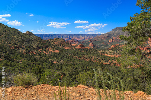 View of Red Rock Spires and Mountains in Distance, Sedona, Arizona, USA, horizontal