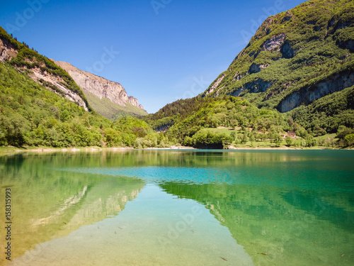 Lake Tenno surrounded by Italian alps.