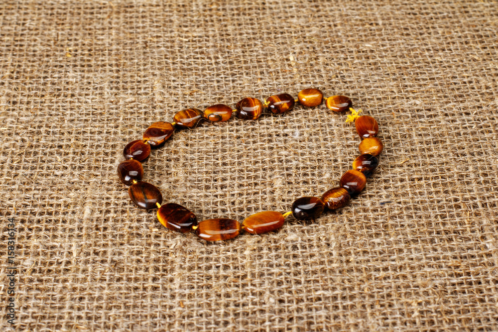 Colorful beads on a background of fabric Colorful beads on a background of fabric