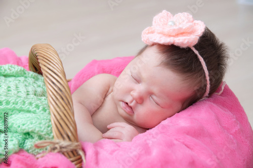 newborn sleeping in basket, baby girl lying in pink blanket, cute child, daughter announcement