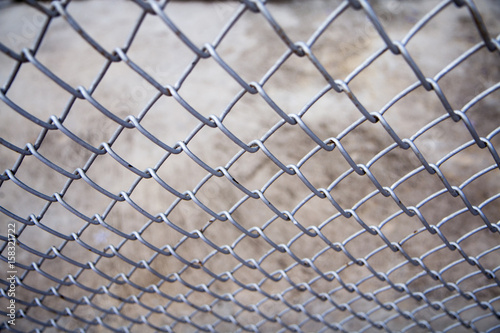 metal fence with concrete background.