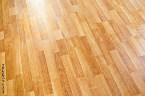 Laminate wooden floor surface in the modern home background. © DG PhotoStock