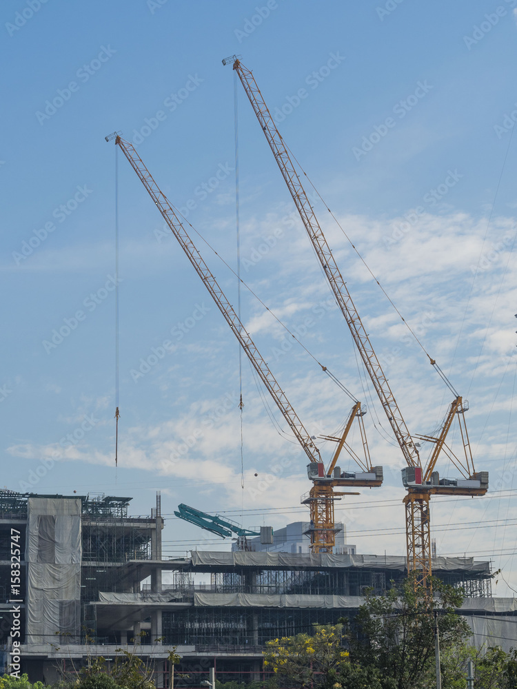 Two cranes were used to canstuction the building Two cranes were used to canstuction the building