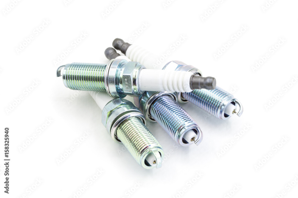 Ignition plug isolated on white, automotive part Ignition plug isolated on white, automotive part