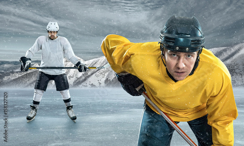 Photography Ice hockey player on the ice in mountains