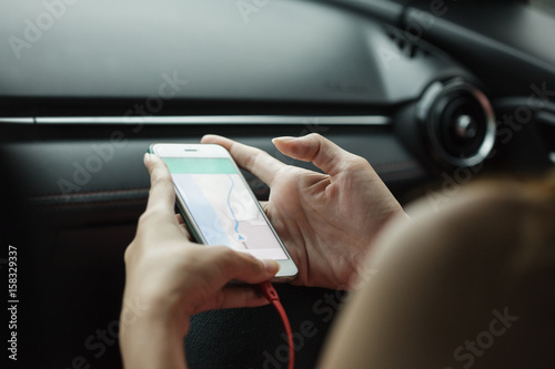 close-up woman using map app on phone mobile