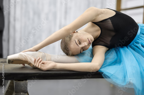 Ballerina posing on table