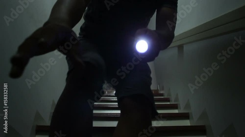 Men using flashlight after power outage photo