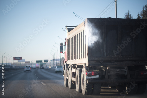 Soft focus Smoked truck on the frosty winter road