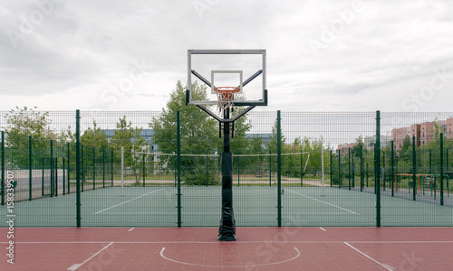 Outdoor basketball court in a public park.