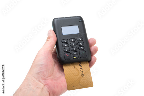 カードリーダー　端末　読取機　POS Terminal with credit card isolated on a white background