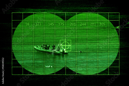 Scuba divers on boat through night vision