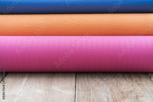 yoga mats on the wooden table background