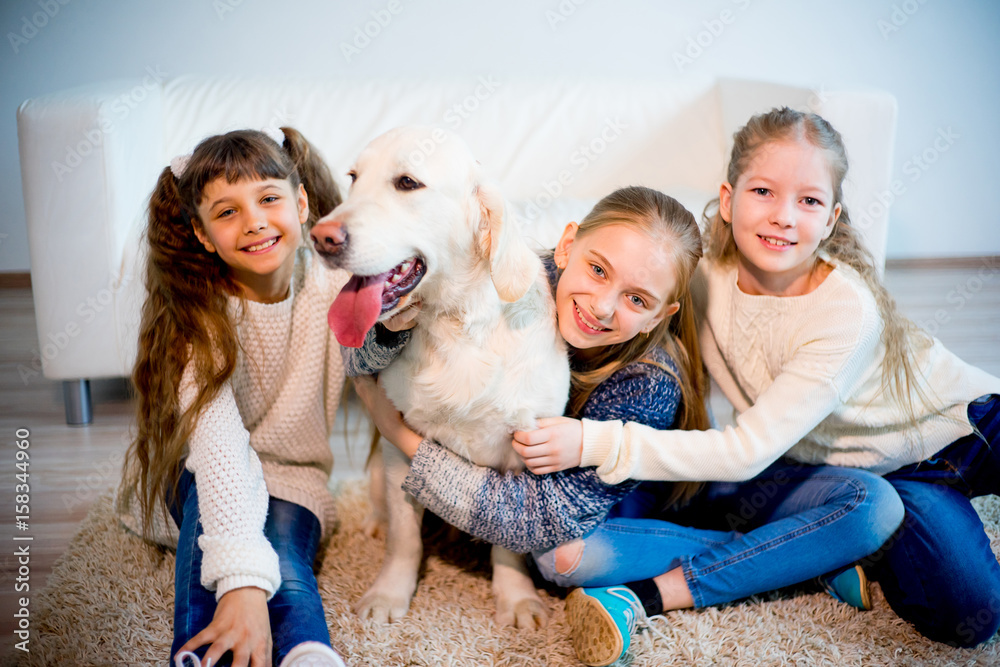 Children playing with a dog Children playing with a dog