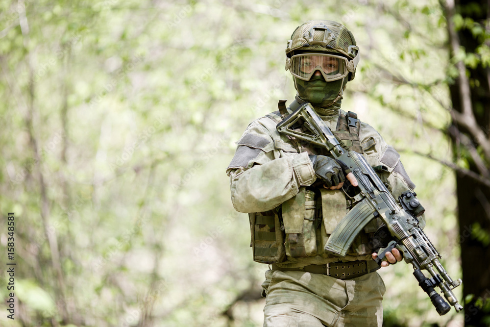 Soldier in camouflage and helmet