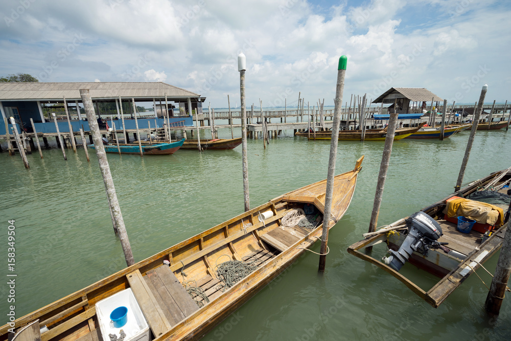 Fisherman boats anchored at Tanjung Piai jetty. Tanjung Piai is a cape in Johor, Malaysia. It is the most southern point of mainland Asia. Fisherman boats anchored at Tanjung Piai jetty. Tanjung Piai is a cape in Johor, Malaysia. It is the most southern point of mainland Asia.