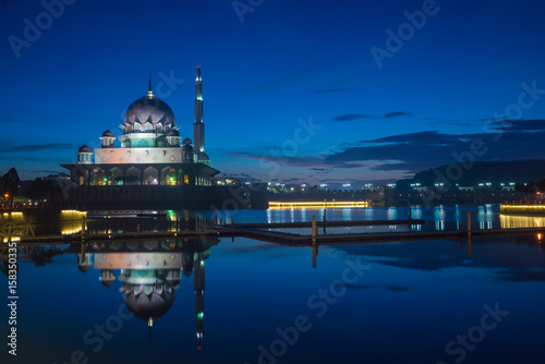 Sunrise moment at Putra Mosque, a principal mosque of Putrajaya, Malaysia. Construction of the mosque began in 1997 and was completed two years later. © ShaifulZamri