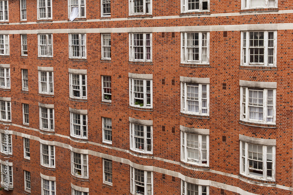 brick building facade - tenement building exterior, England