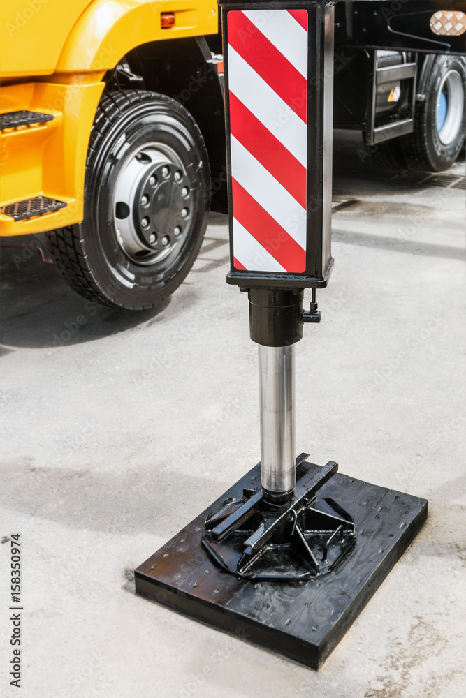 hydraulics crane support. hydraulics crane support is on gravel. focus