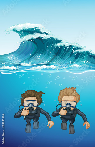 Two divers under the ocean