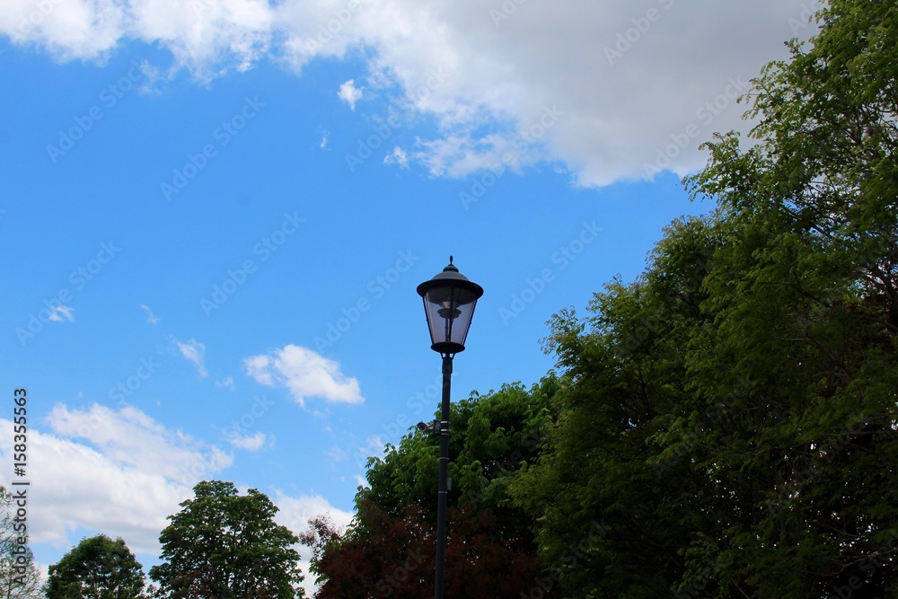 The light post with the blue sky and the clouds in background/ The light post with the blue sky and the clouds in background/