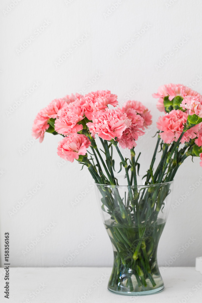 Bouquet of carnation in a glass