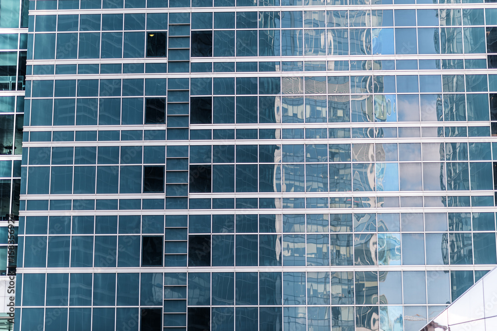window reflections at the glass facade of an office building