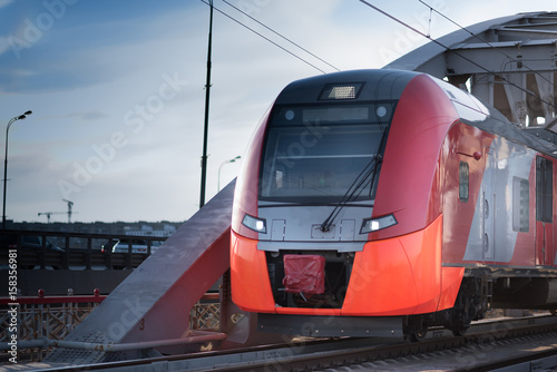 2017, 15 APR Red speed train goes through the iron bridge at the centre of the Moscow, Russia photo