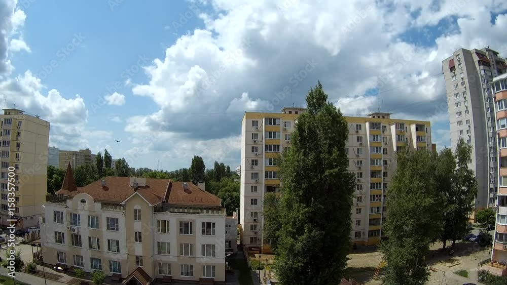 Cumulus clouds floating over the houses (timelapse) Cumulus clouds floating over the houses (timelapse)