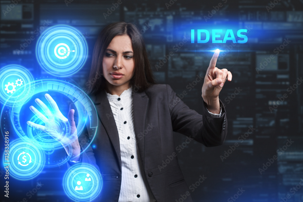 The concept of business, technology, the Internet and the network. A young entrepreneur working on a virtual screen of the future and sees the inscription: Ideas The concept of business, technology, the Internet and the network. A young entrepreneur working on a virtual screen of the future and sees the inscription: Ideas